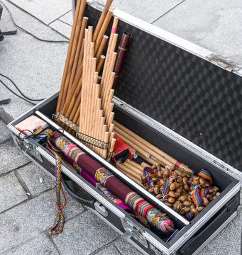 Andean musical instruments in case on street. Pan flutes, zampona, siku.  Folk music.