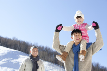 Three generation family having fun in snow