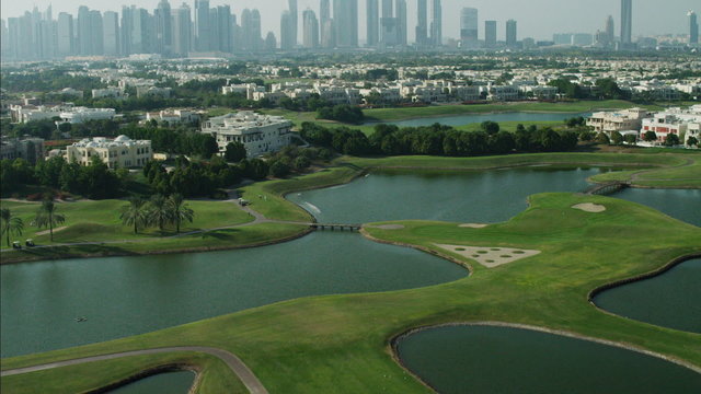 Aerial Dubai luxury homes Emirates Hills Golf Persian Gulf UAE