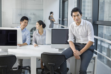 Portrait of young businessman in office