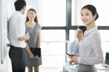 Portrait of young businesswoman in office