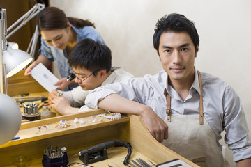 Jewelers working in studio