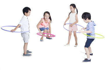 Fototapeta premium Happy children spinning plastic hoops