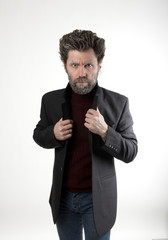 Mr. IceMan aggression, fashion man in knitted sweater and jacket. 