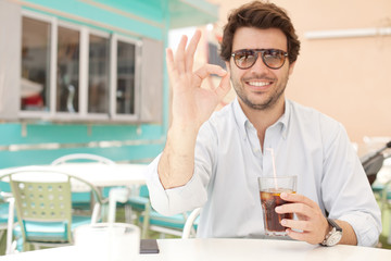 Young man drinking a beverage