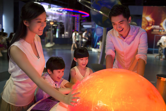 Young family in science and technology museum