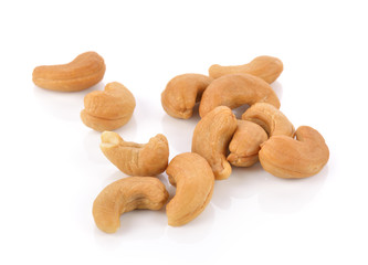 Roasted cashew nuts whith salt on white background