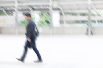 motion blur business man walking to work