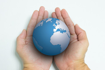 Isolated opened hands and the earth