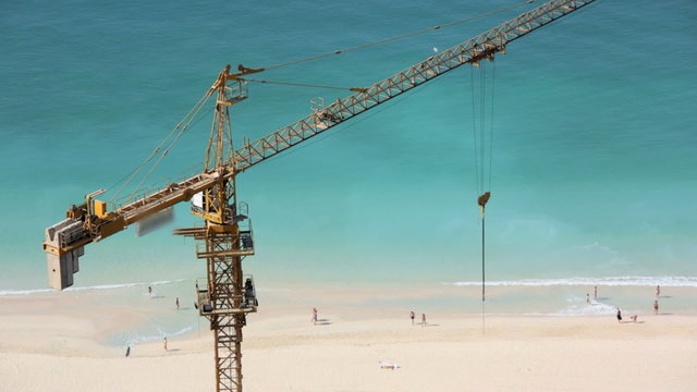 construction real estate building development Dubai beach crane tourist tourism