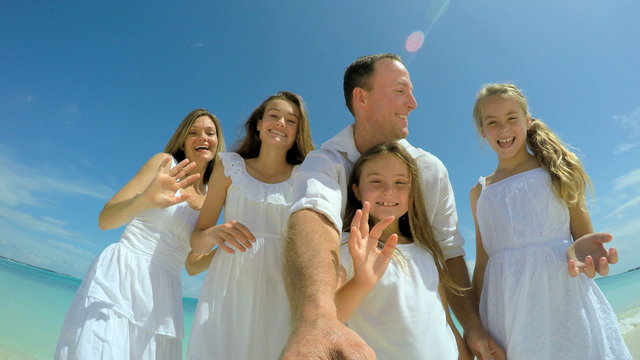 Video selfie of smiling carefree Caucasian family playing 