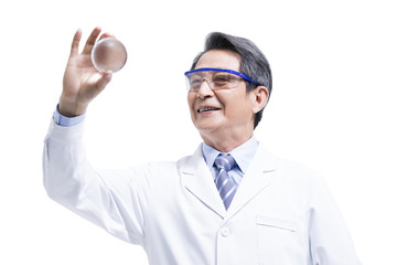 Scientist examining a transparent ball