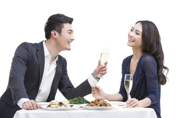 Happy young couple having dinner