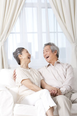 Happy senior couple laughing