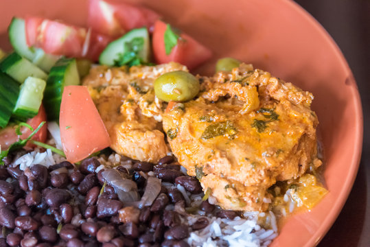 Cuban Cuisine: Chicken Breast In Tomato Sauce With White Rice,black Beans And Salad