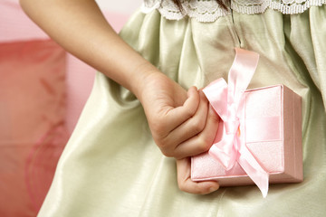 Girl Holding Gift Behind Back