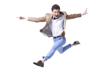 Trendy businessman jumping in mid-air