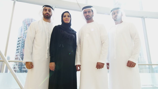 portrait UAE business male female city office kandura abaya stocks shares broker