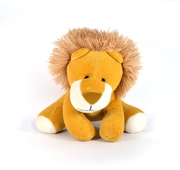 Plush Lion looking at the camera on a white background