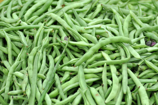 Freshly harvested green peas in a market