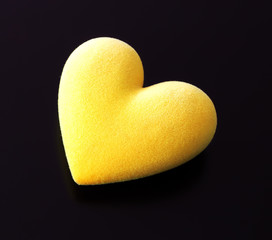 Yellow fluffy heart on a black background