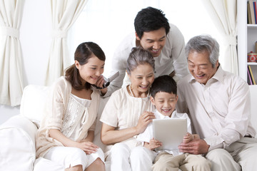 Happy family using an ipad together