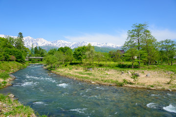 Shirouma mountains and Himekawa river at Ooide park in Hakuba, Nagano, Japan