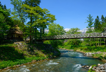 Fototapeta na wymiar Shirouma mountains and Himekawa river at Ooide park in Hakuba, Nagano, Japan