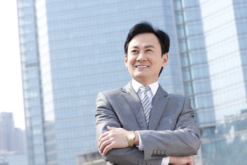 Confident businessman arms crossed