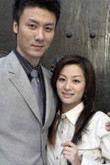 Businesspeople Standing With Arms Around Each Other