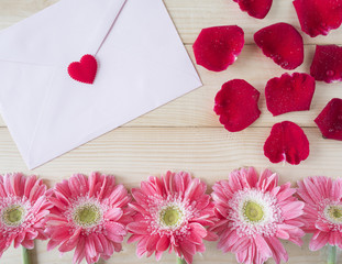 Red roses, pink flower and pink envelope 1
