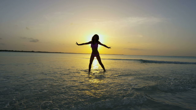 Sunset view of Asian Chinese girl in vacation beach resort