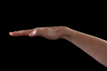 Hand on black background