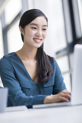 Young businesswoman working in office