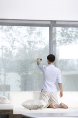 Man taking a self-portrait in the living room