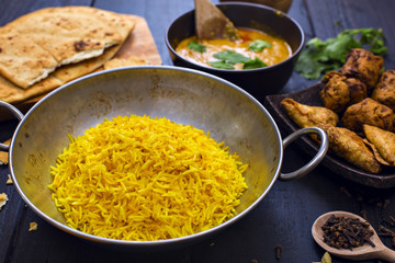 Indian chicken pilau rice in balti dish served with tikka masala