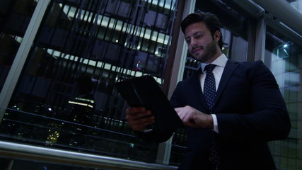 Caucasian European business male night developer traveller technology tablet