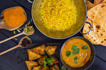 Indian pilau rice in balti dish served with chicken tikka masala