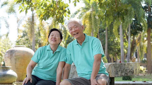 Asian senior couple relaxing in the park