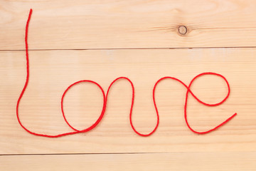 Love sign on wooden background