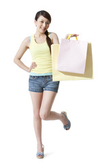 Happy young woman with shopping bags