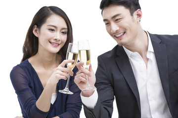 Happy young couple toasting champagne flutes