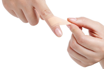 Woman Putting On A Bandage