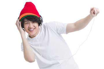Fashionable young man listening to music