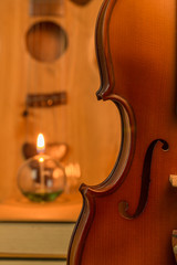 Acoustic guitar,violin,lantern  on floor still life style