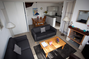 Contemporary living room with a dining area and kitchen