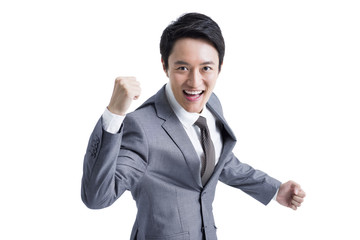 Excited businessman punching the air