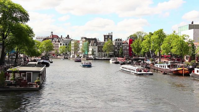 Famous Canals of Amsterdam, Netherlands. Amsterdam is a large European capital with a number of historical buildings, monuments and museums. Its various canals itself add to its beauty.