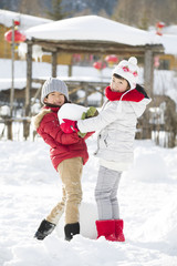 Happy children playing in the snow