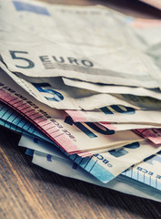 Several hundred euro banknotes stacked by value. Euro money concept. Euro banknotes. Euro money. Euro currency. Banknotes stacked on each other in different positions. Toned photo